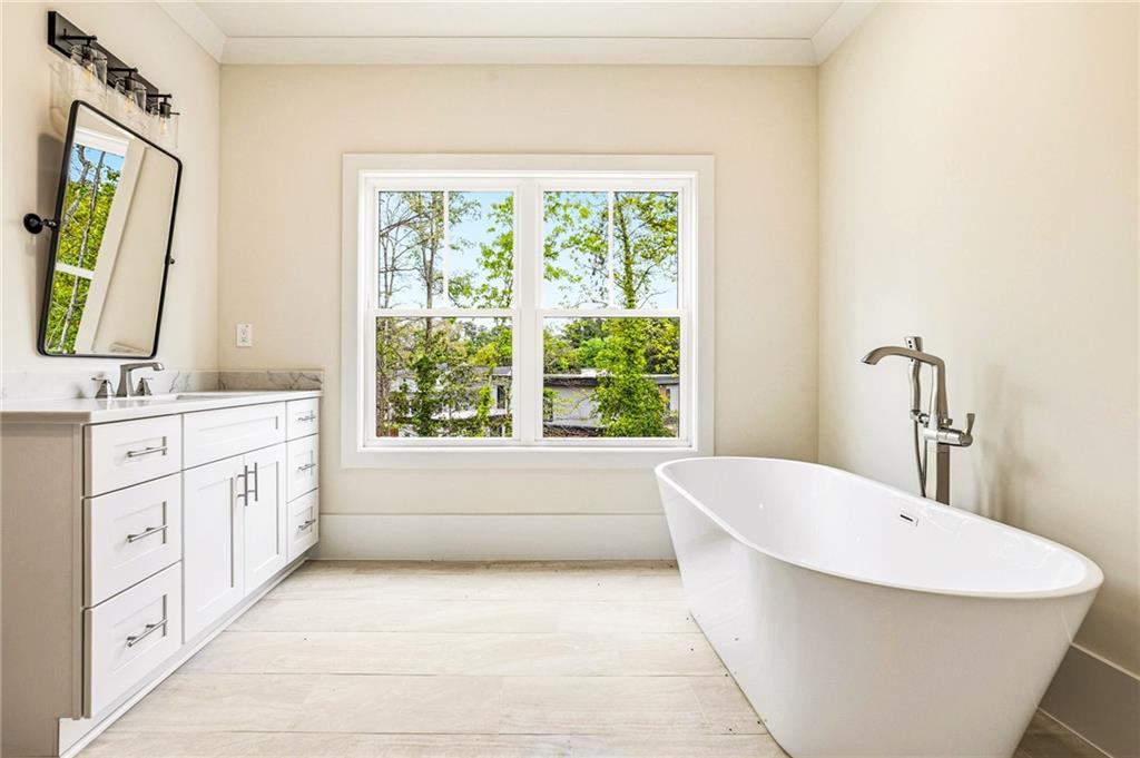 1967 Highgrove Court Decatur, GA 30033 - Photo 37 of 60 a bathroom with a granite countertop sink and a bathtub