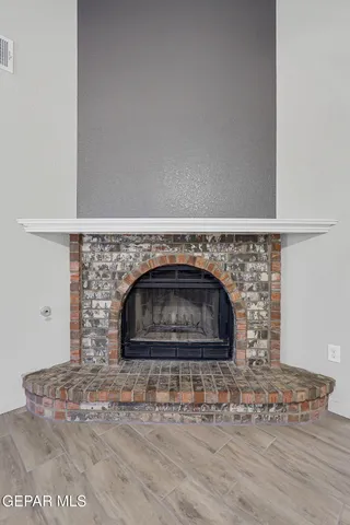 a stone house with a fireplace