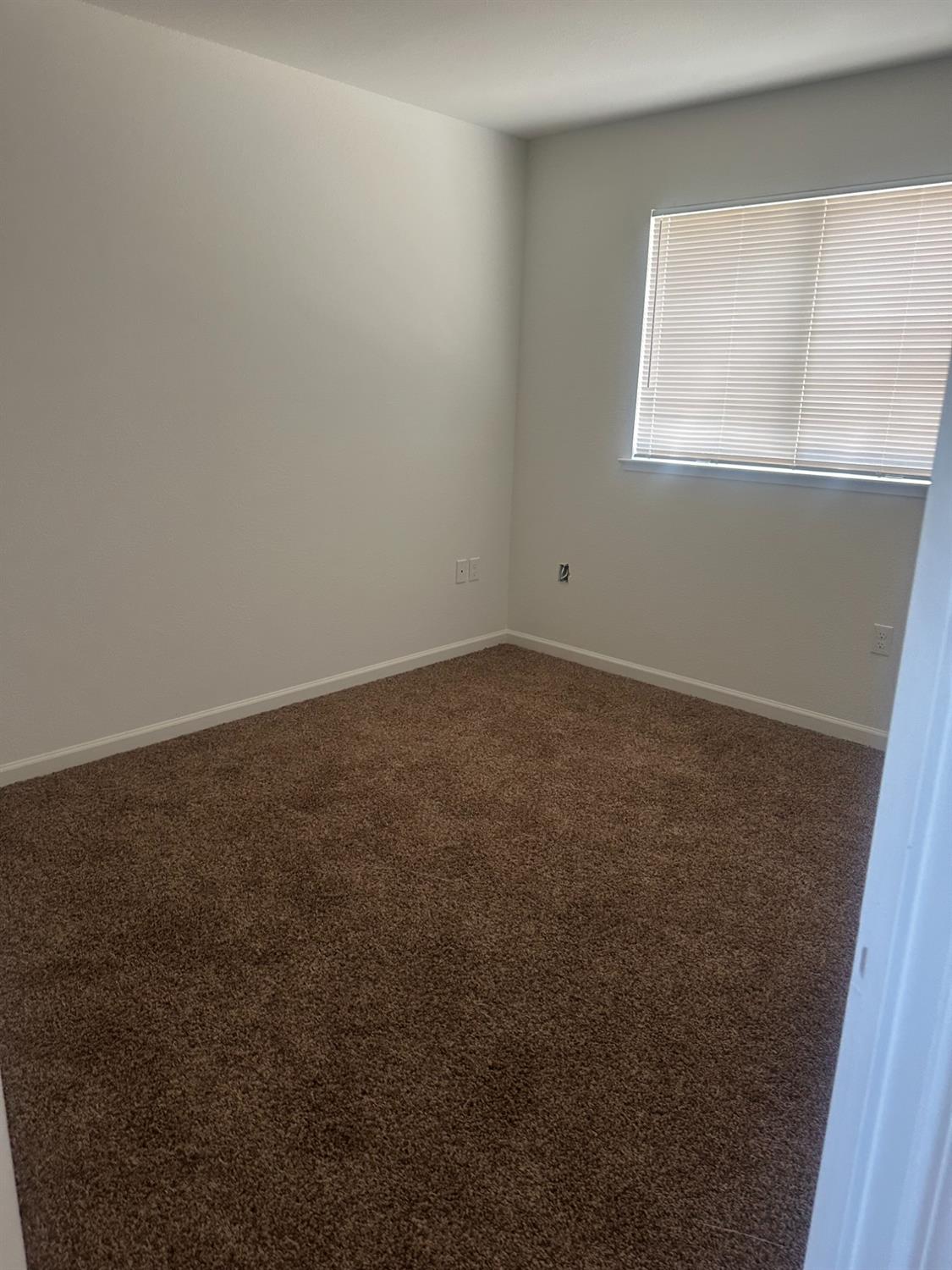 54 North Randy Avenue, Unit B Clovis, CA 93612 - Photo 9 of 9 an empty room with a window