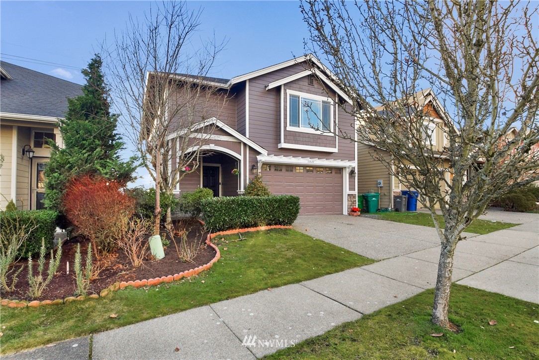 22632 43rd Drive Southeast Bothell, WA 98021 - Photo 3 of 33 a front view of a house with a yard and potted plants