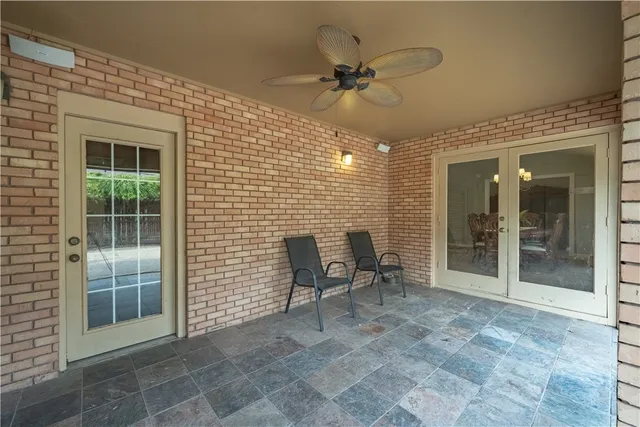 a backyard of a house with lots of green space and outdoor seating