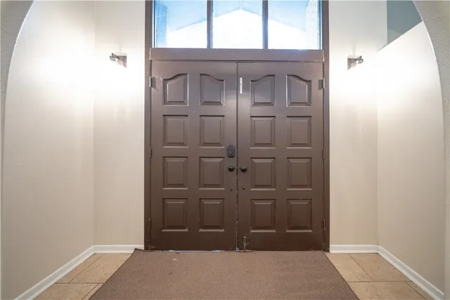 a view of a hallway with a window
