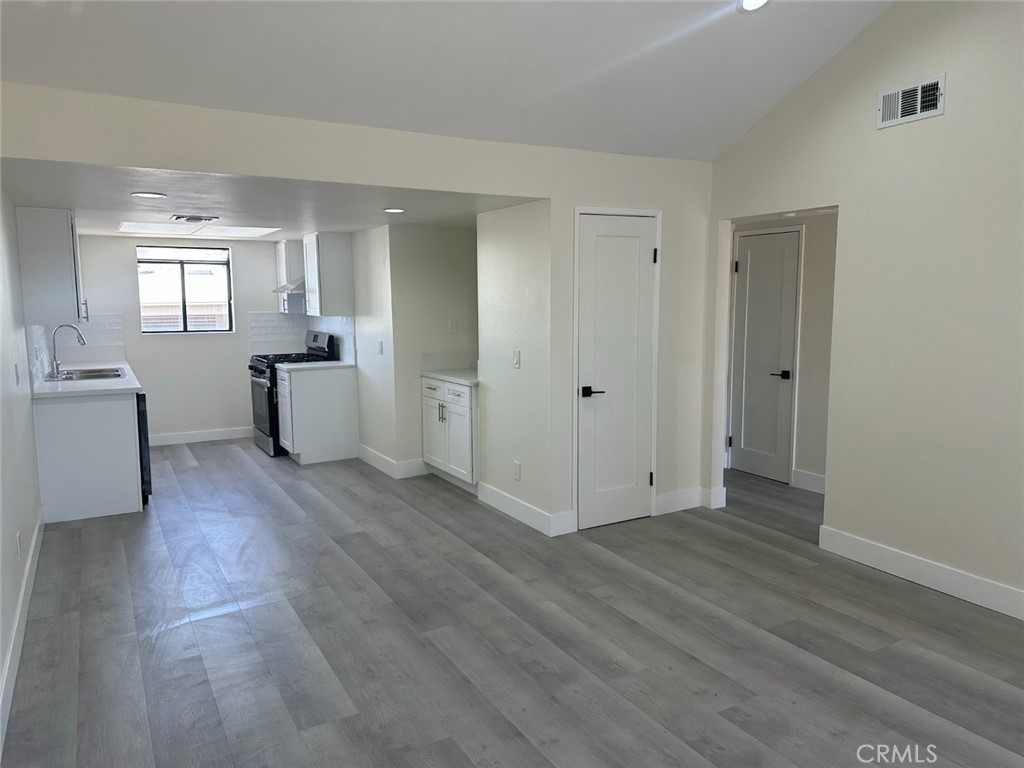 44155 10th Lancaster, CA 93534 - Photo 1 of 15 a view of a room with wooden floor and windows
