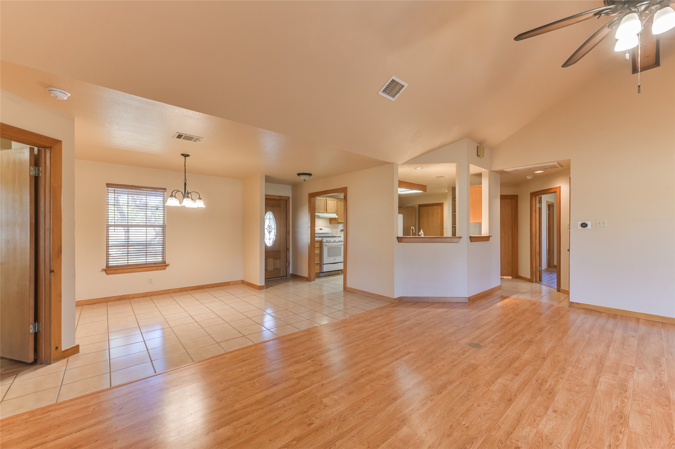 1201 Sandy Point Road Wimberley, TX 78676 - Photo 11 of 40 a view of a big room with wooden floor and a kitchen