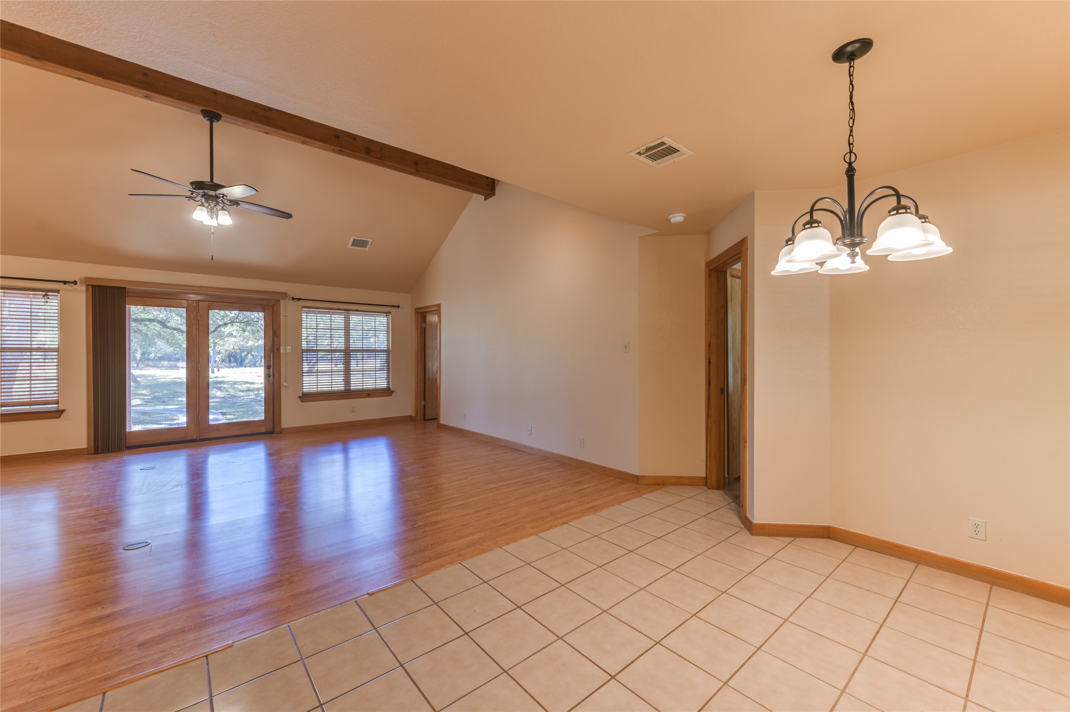1201 Sandy Point Road Wimberley, TX 78676 - Photo 15 of 40 a view of empty room with wooden floor and fan