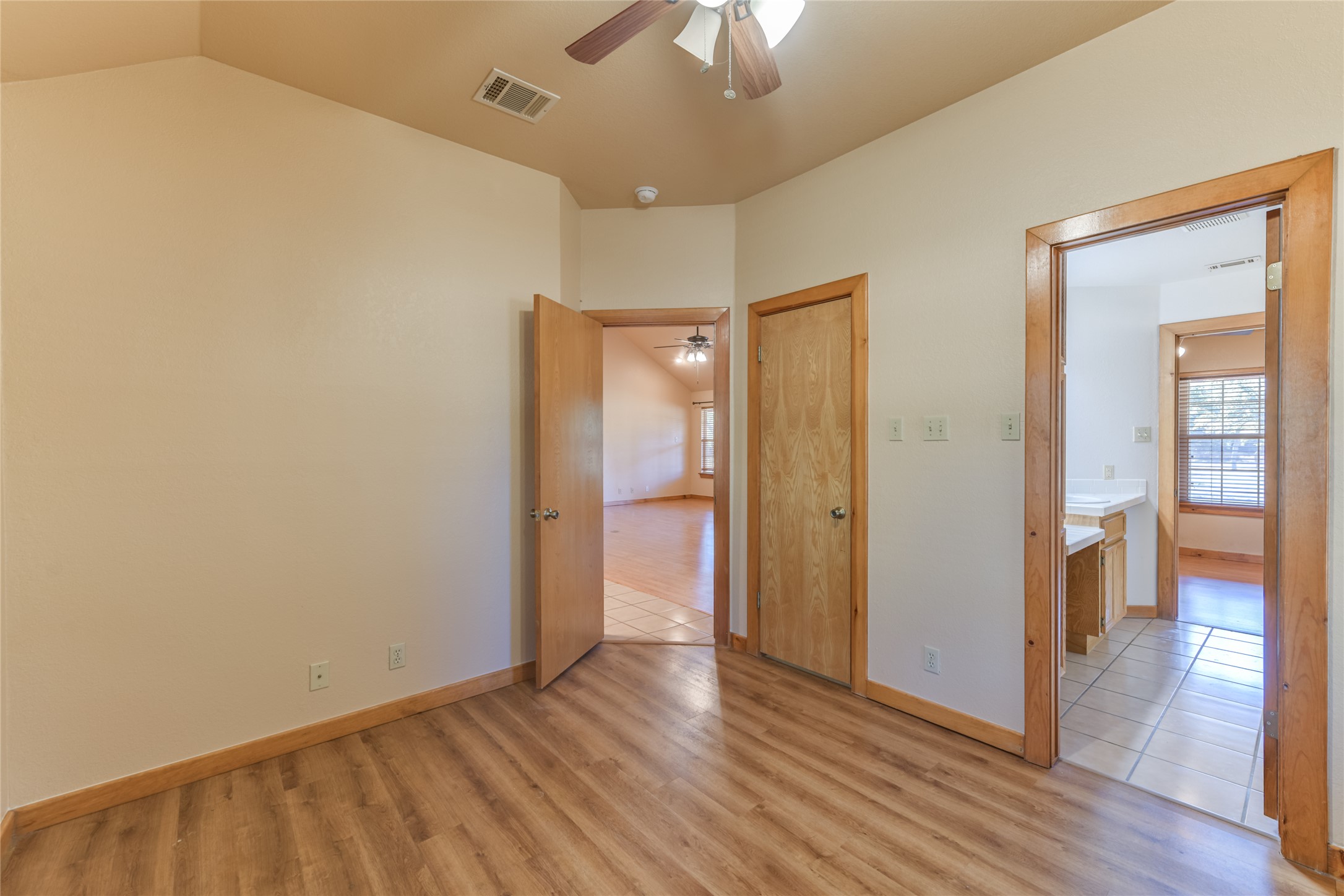 1201 Sandy Point Road Wimberley, TX 78676 - Photo 24 of 40 a view of an empty room and wooden floor