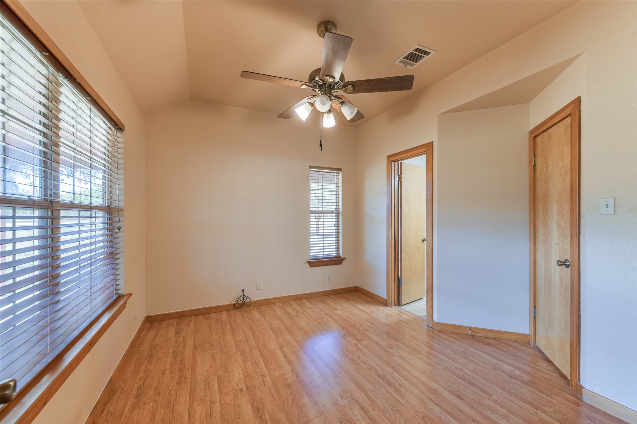 1201 Sandy Point Road Wimberley, TX 78676 - Photo 26 of 40 wooden floor in an empty room with a window