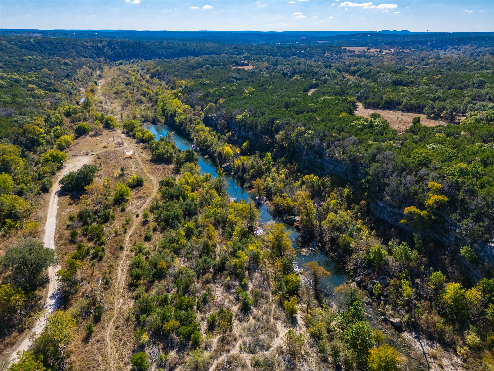 1201 Sandy Point Road Wimberley, TX 78676 - Photo 34 of 40 a view of a city with lush green forest