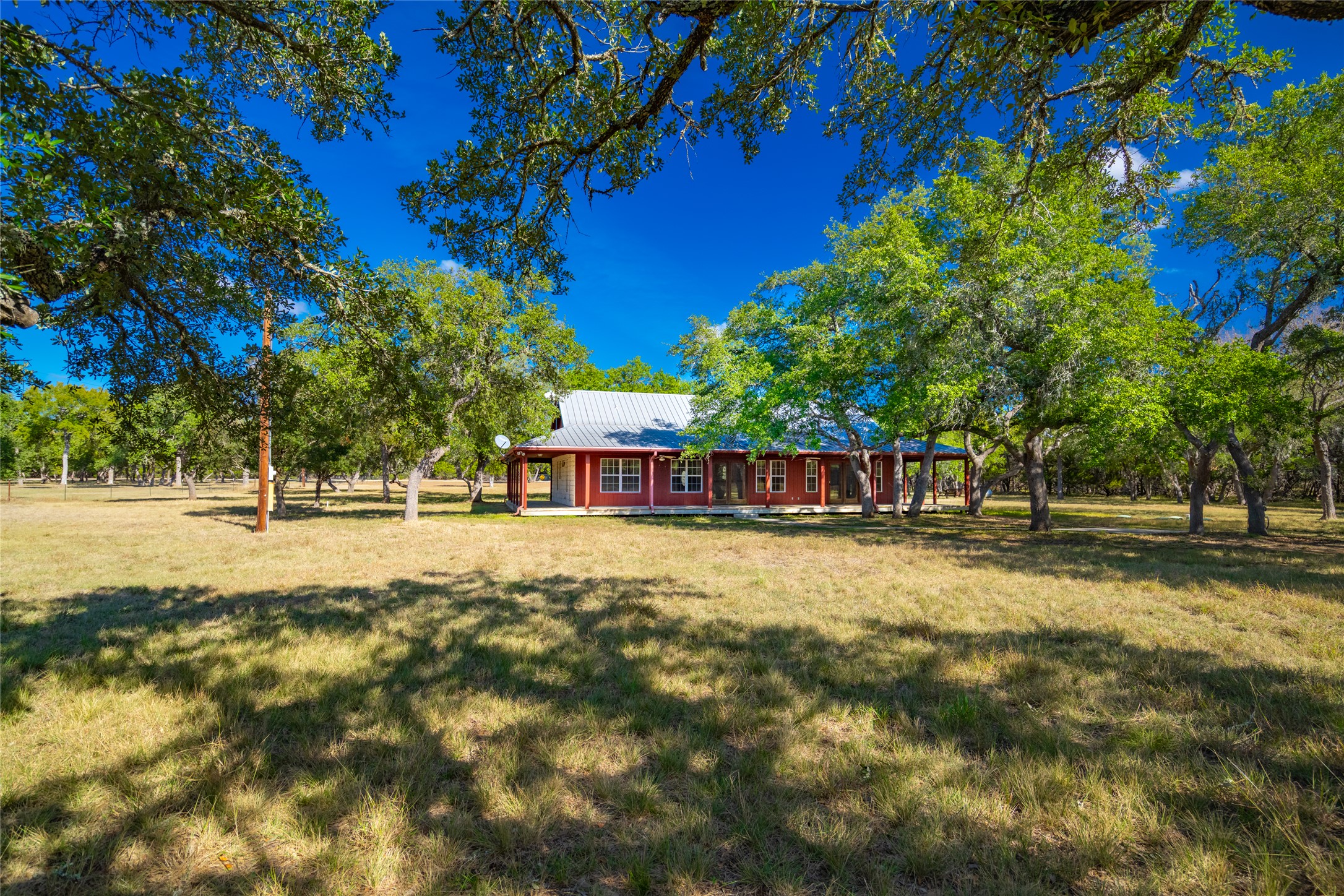 1201 Sandy Point Road Wimberley, TX 78676 - Photo 5 of 40 a view of a house with a yard