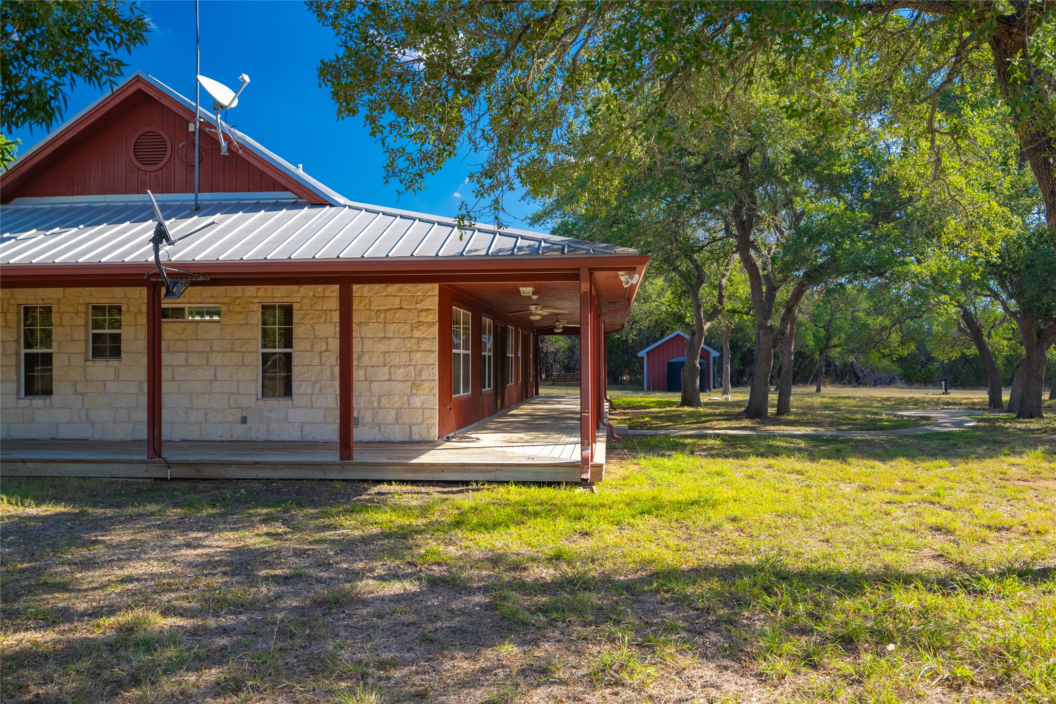 1201 Sandy Point Road Wimberley, TX 78676 - Photo 7 of 40 a view of swimming pool with lawn chairs under an umbrella