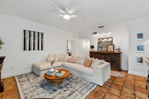 a living room with furniture and a rug