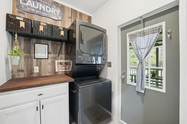 a kitchen with stainless steel appliances a sink stove and cabinets