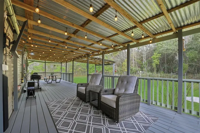 a patio with patio lots of furniture and wooden floor
