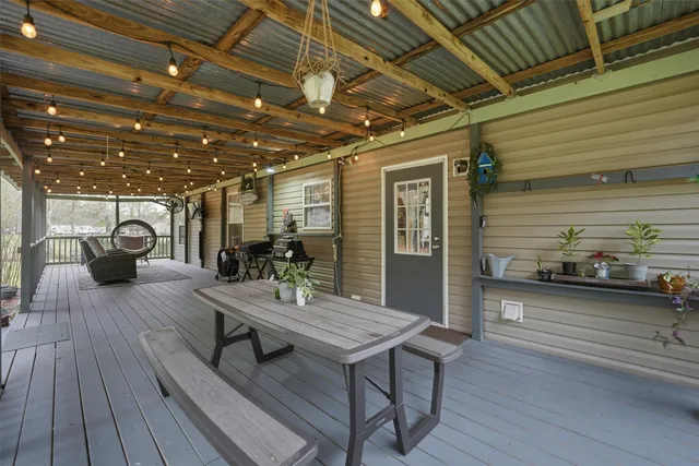 a outdoor space with lots of wooden furniture