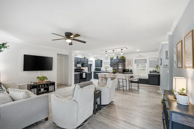 a living room with furniture and a flat screen tv