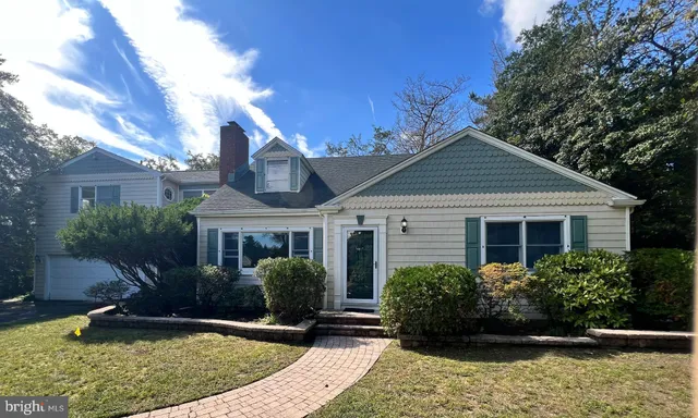 a aerial view of a house with a yard