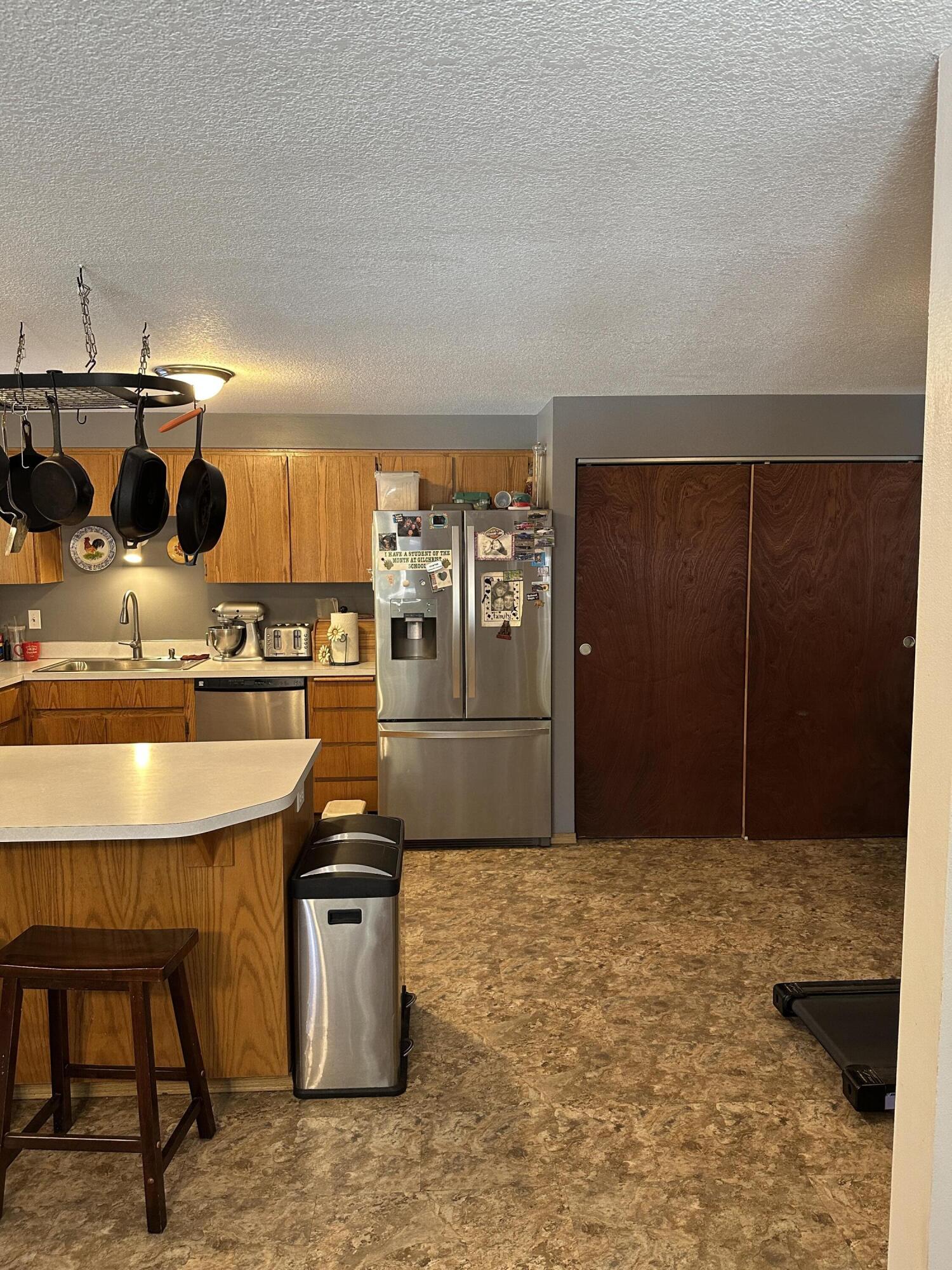 123977 Surveyor Road Crescent Lake, OR 97733 - Photo 18 of 41 a kitchen with stainless steel appliances kitchen island a stove and a refrigerator
