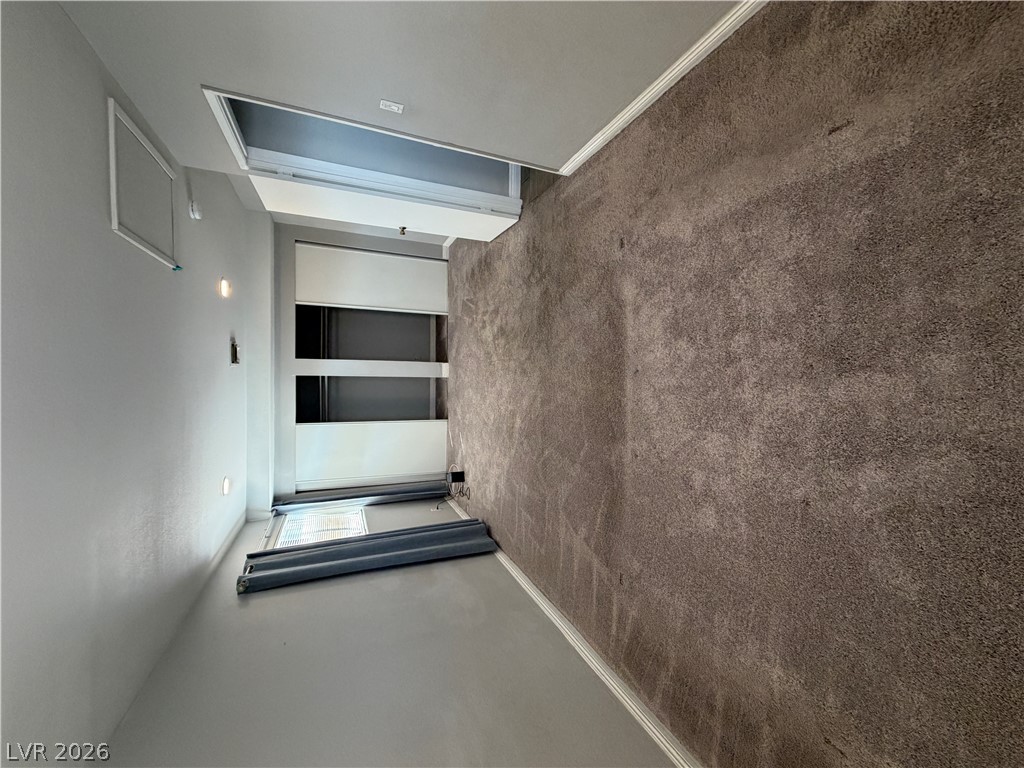 2820 South Sandhill Road, Unit A Las Vegas, NV 89121 - Photo 23 of 26 Plush carpeting and integrated storage solutions define this cozy interior space.