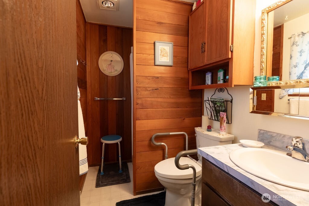 371 Flora Place Forks, WA 98331 - Photo 17 of 40 a bathroom with a sink a toilet and a mirror