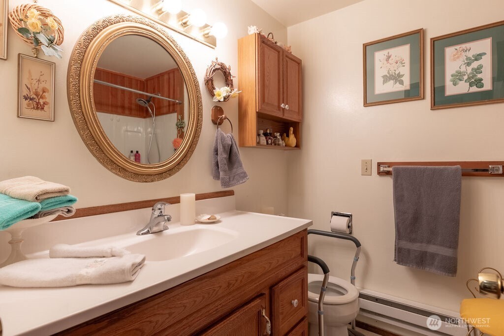 371 Flora Place Forks, WA 98331 - Photo 19 of 40 a bathroom with a sink and a mirror