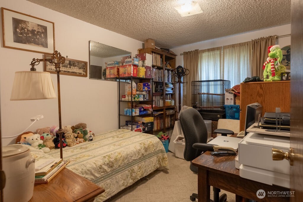 371 Flora Place Forks, WA 98331 - Photo 21 of 40 a bedroom with furniture and a window