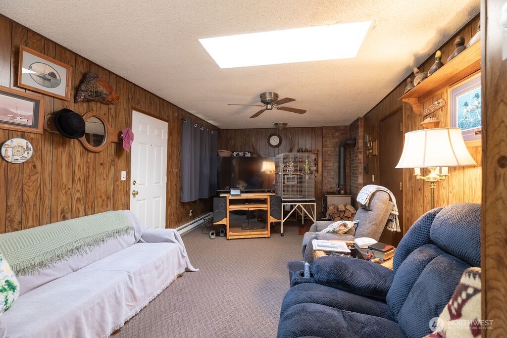 371 Flora Place Forks, WA 98331 - Photo 22 of 40 a living room with furniture and a chandelier