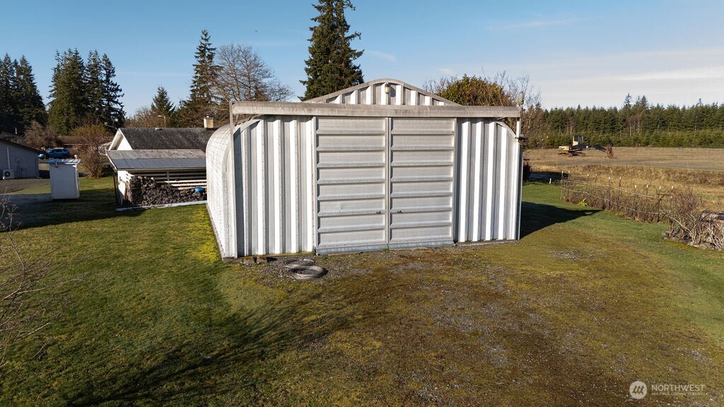 371 Flora Place Forks, WA 98331 - Photo 28 of 40 a view of a house with backyard and trees