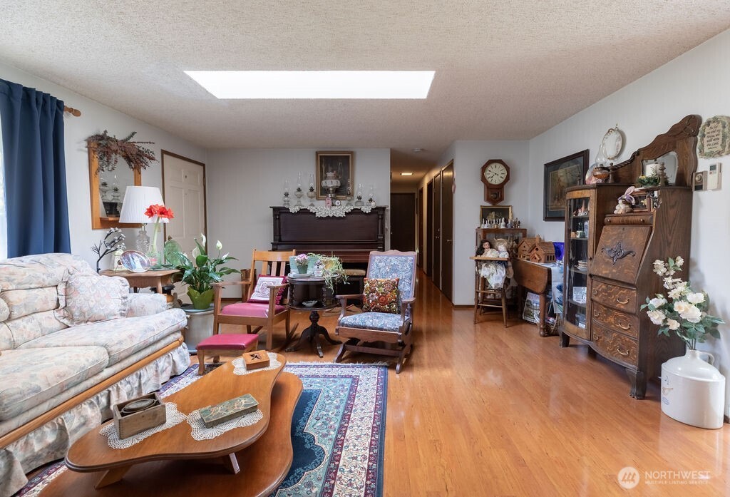 371 Flora Place Forks, WA 98331 - Photo 3 of 40 a living room with furniture and a flat screen tv