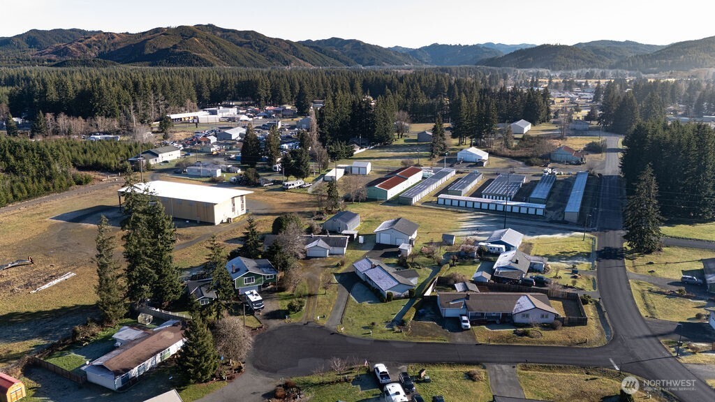 371 Flora Place Forks, WA 98331 - Photo 35 of 40 a view of a house with a backyard and a lake view