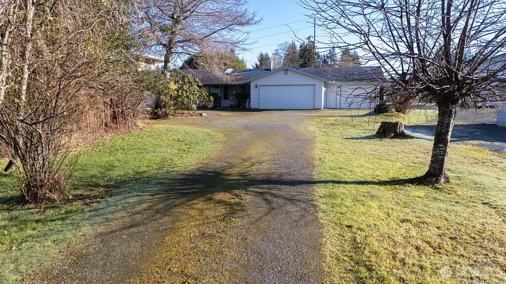 371 Flora Place Forks, WA 98331 - Photo 37 of 40 a view of a garden with trees