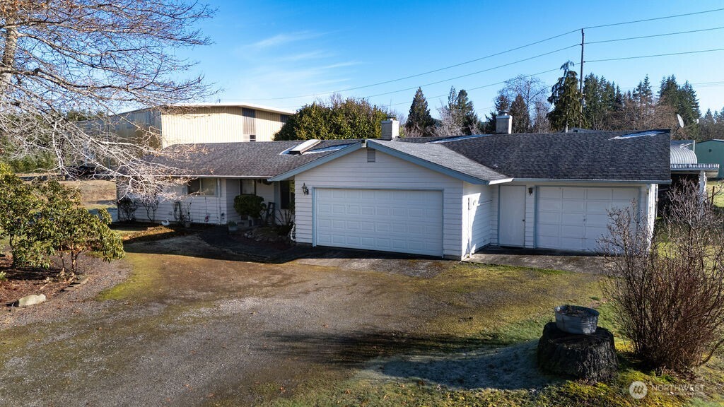 371 Flora Place Forks, WA 98331 - Photo 38 of 40 a view of a house with a yard