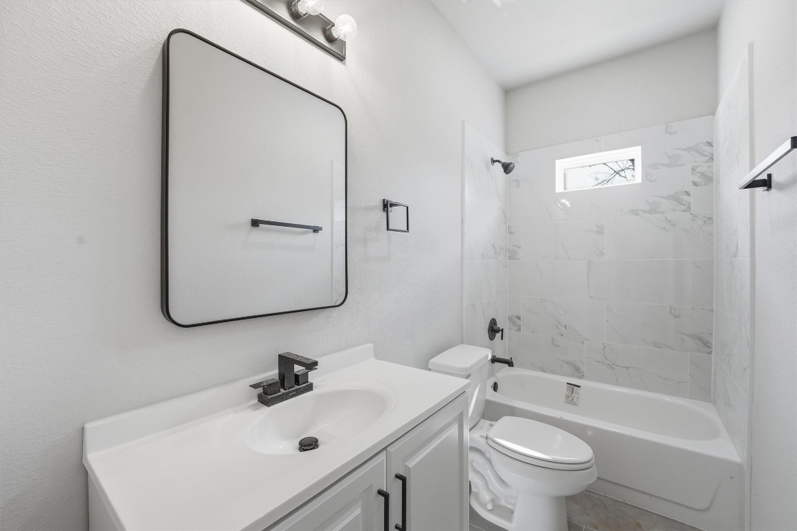 2250 Cable Avenue Beaumont, TX 77703 - Photo 15 of 21 a bathroom with a sink mirror toilet and bathtub