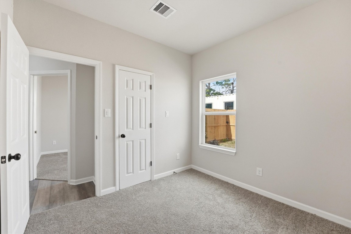 2250 Cable Avenue Beaumont, TX 77703 - Photo 16 of 21 an empty room with windows and closet