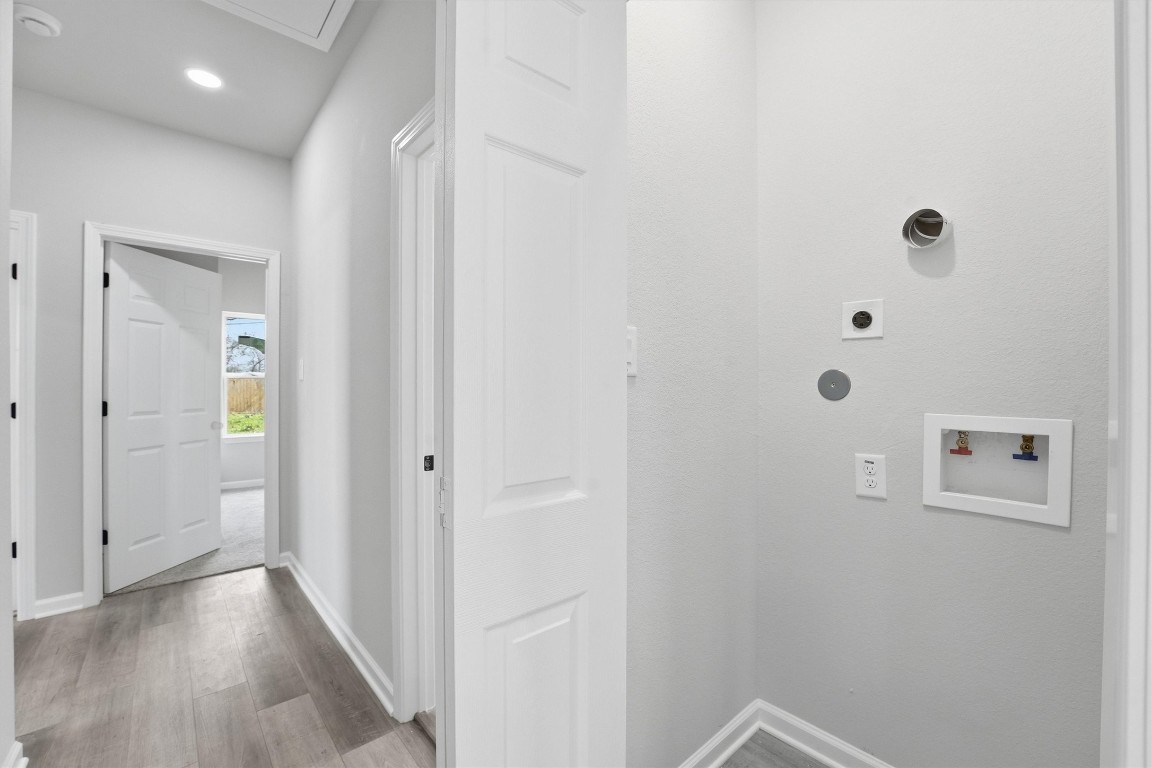2250 Cable Avenue Beaumont, TX 77703 - Photo 20 of 21 a view of a hallway with wooden floor