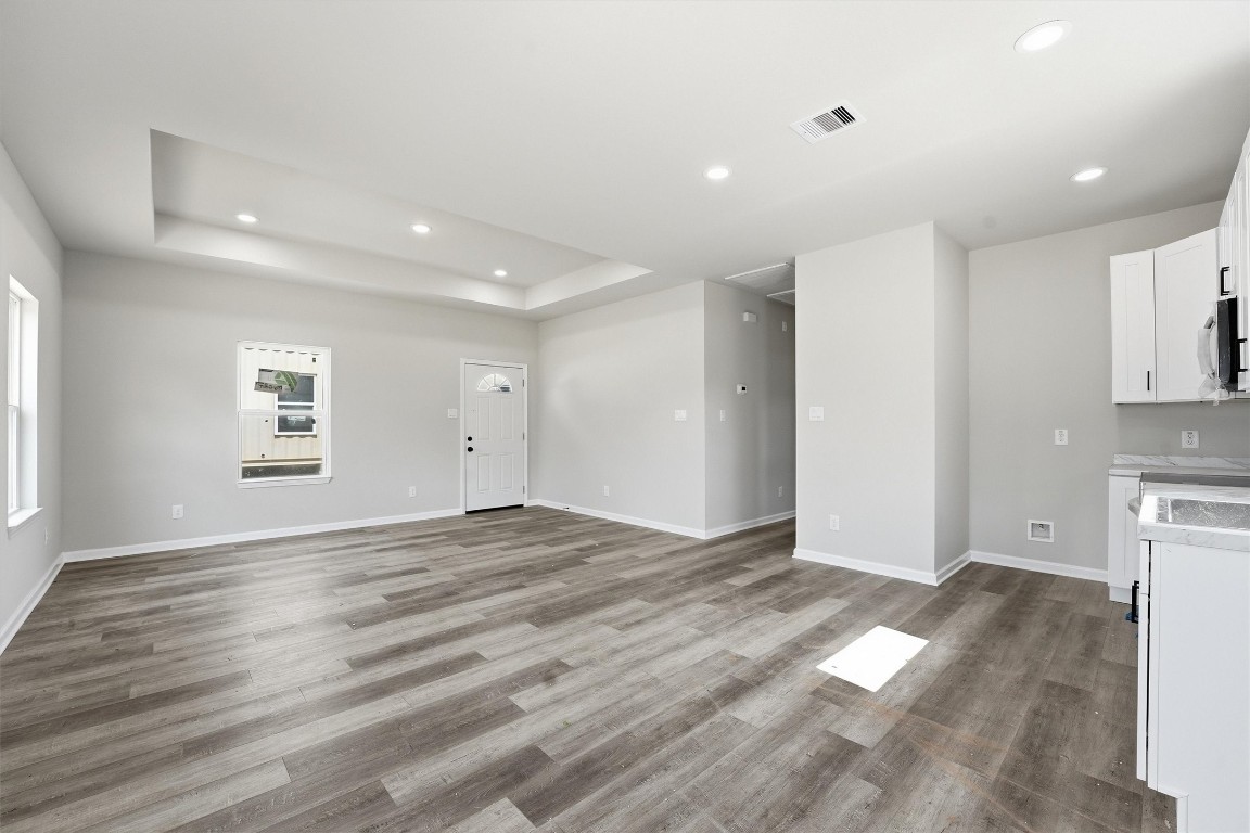 2250 Cable Avenue Beaumont, TX 77703 - Photo 5 of 21 a view of empty room with wooden floor and window