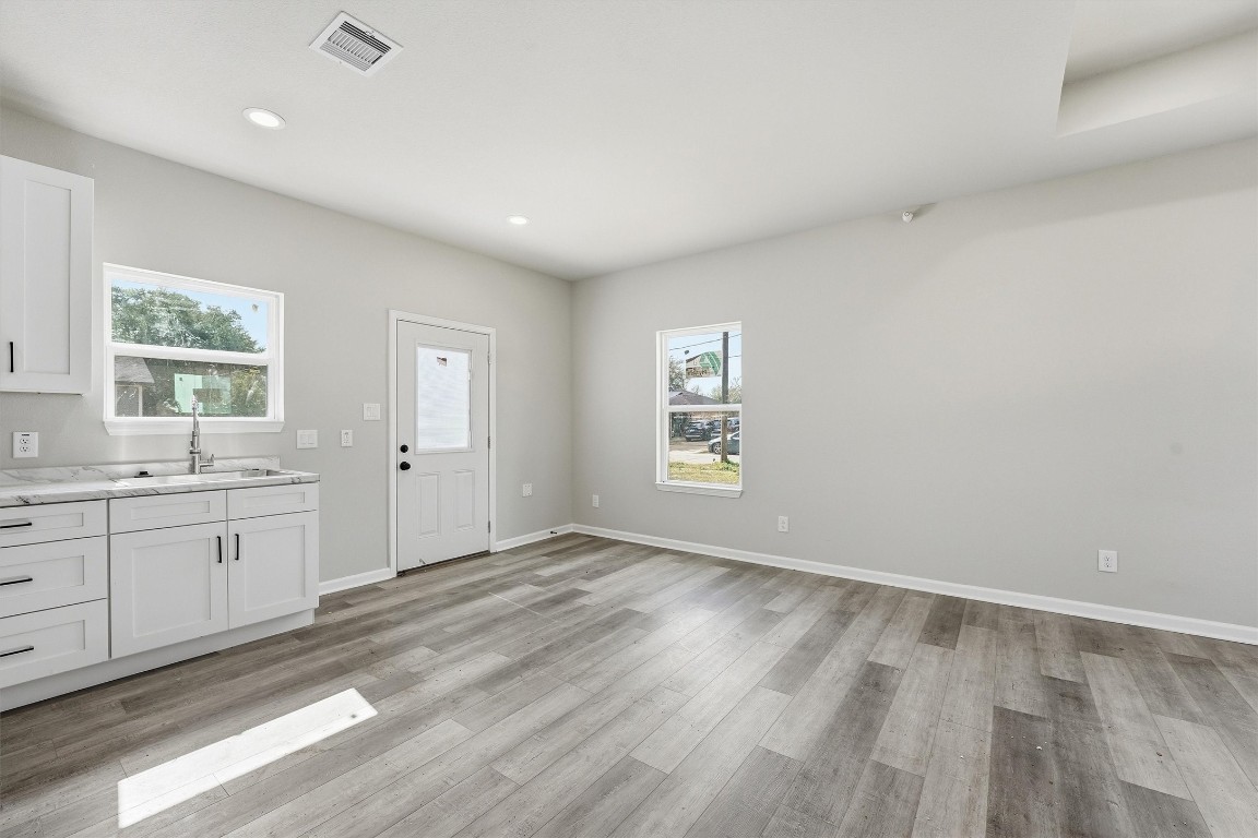 2250 Cable Avenue Beaumont, TX 77703 - Photo 8 of 21 a view of wooden floor and windows in a room