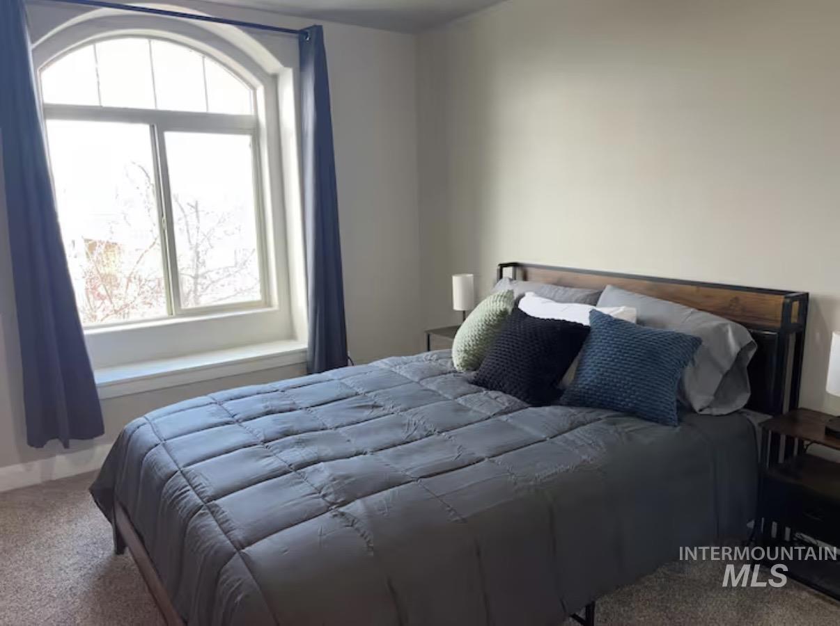 723 Stallion Springs Way Middleton, ID 83644 - Photo 14 of 50 Carpeted bedroom featuring baseboards