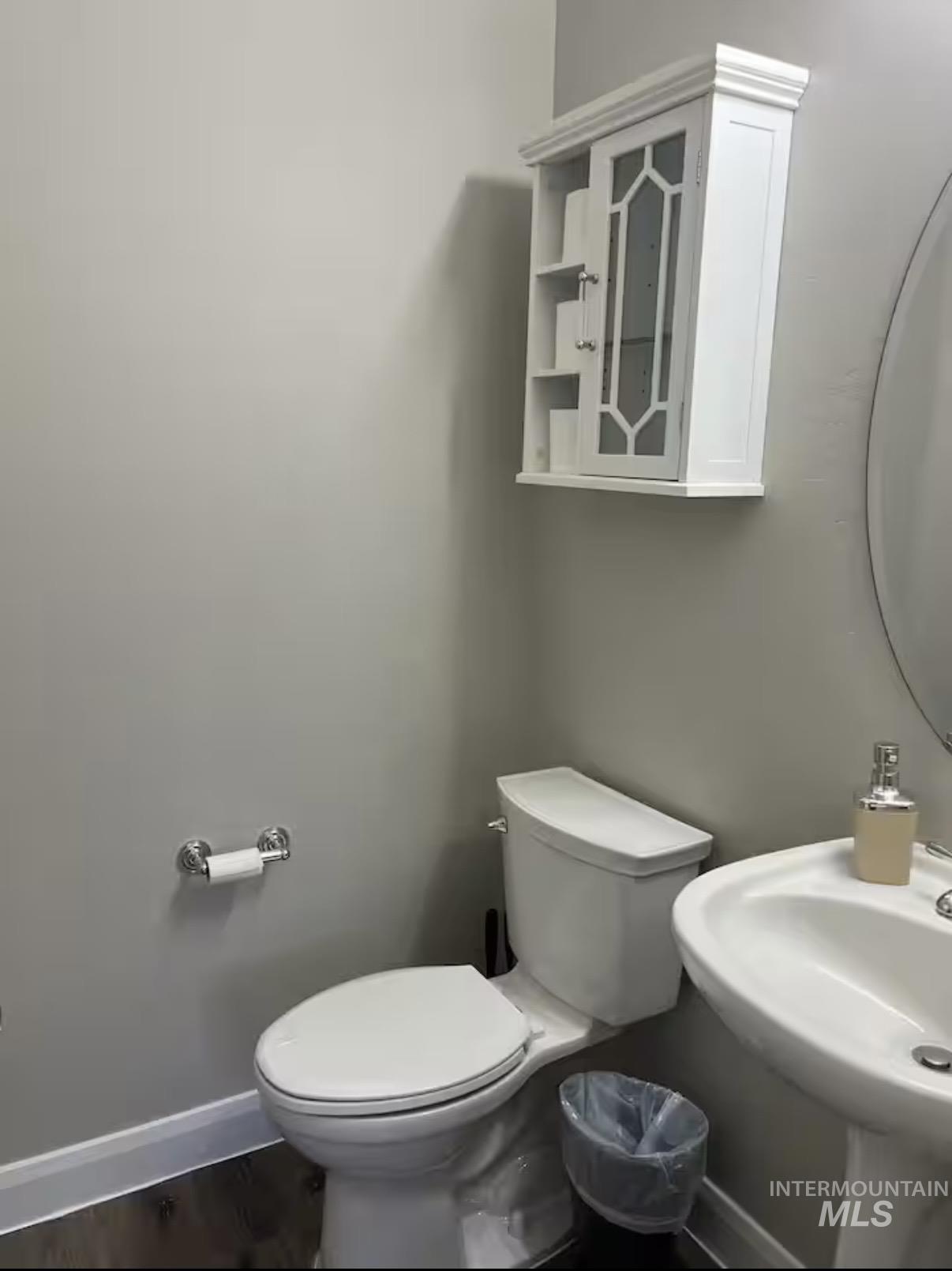 723 Stallion Springs Way Middleton, ID 83644 - Photo 28 of 50 Half bath with toilet and wood finished floors