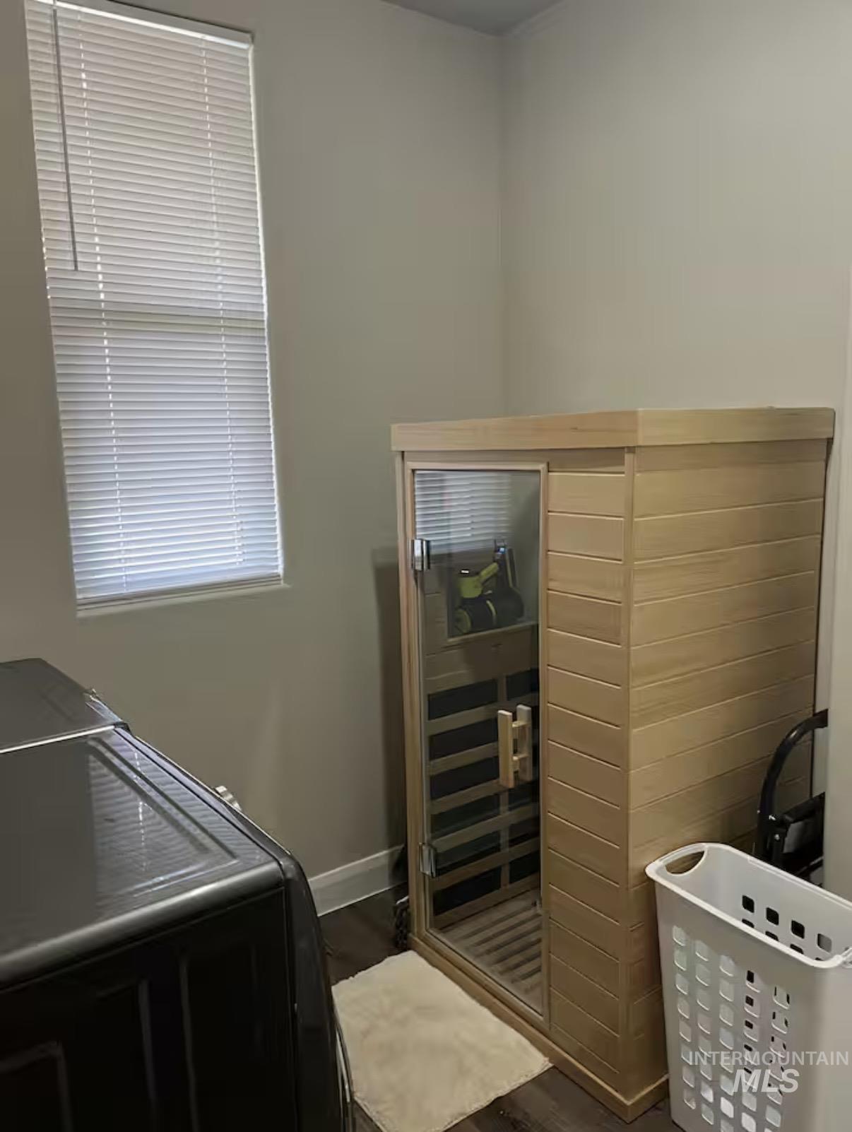 723 Stallion Springs Way Middleton, ID 83644 - Photo 31 of 50 Washroom with a relaxing sauna and dark wood finished floors