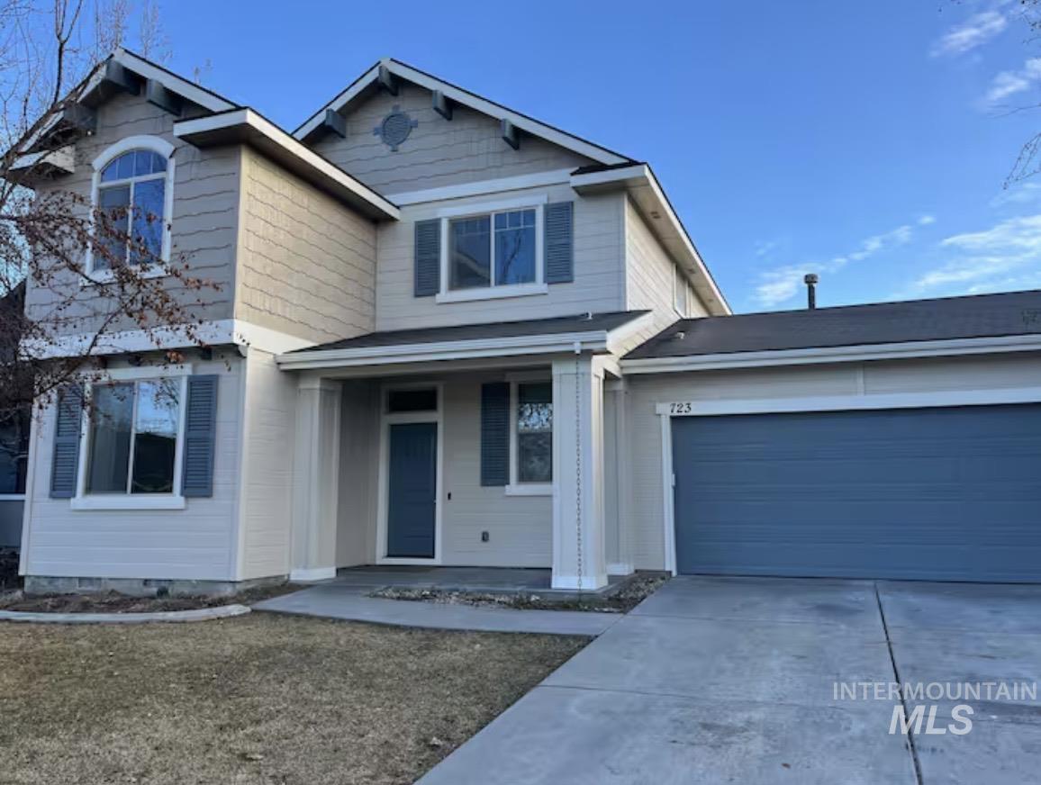 723 Stallion Springs Way Middleton, ID 83644 - Photo 32 of 50 View of front of home with a porch, concrete driveway, a garage, and a front yard