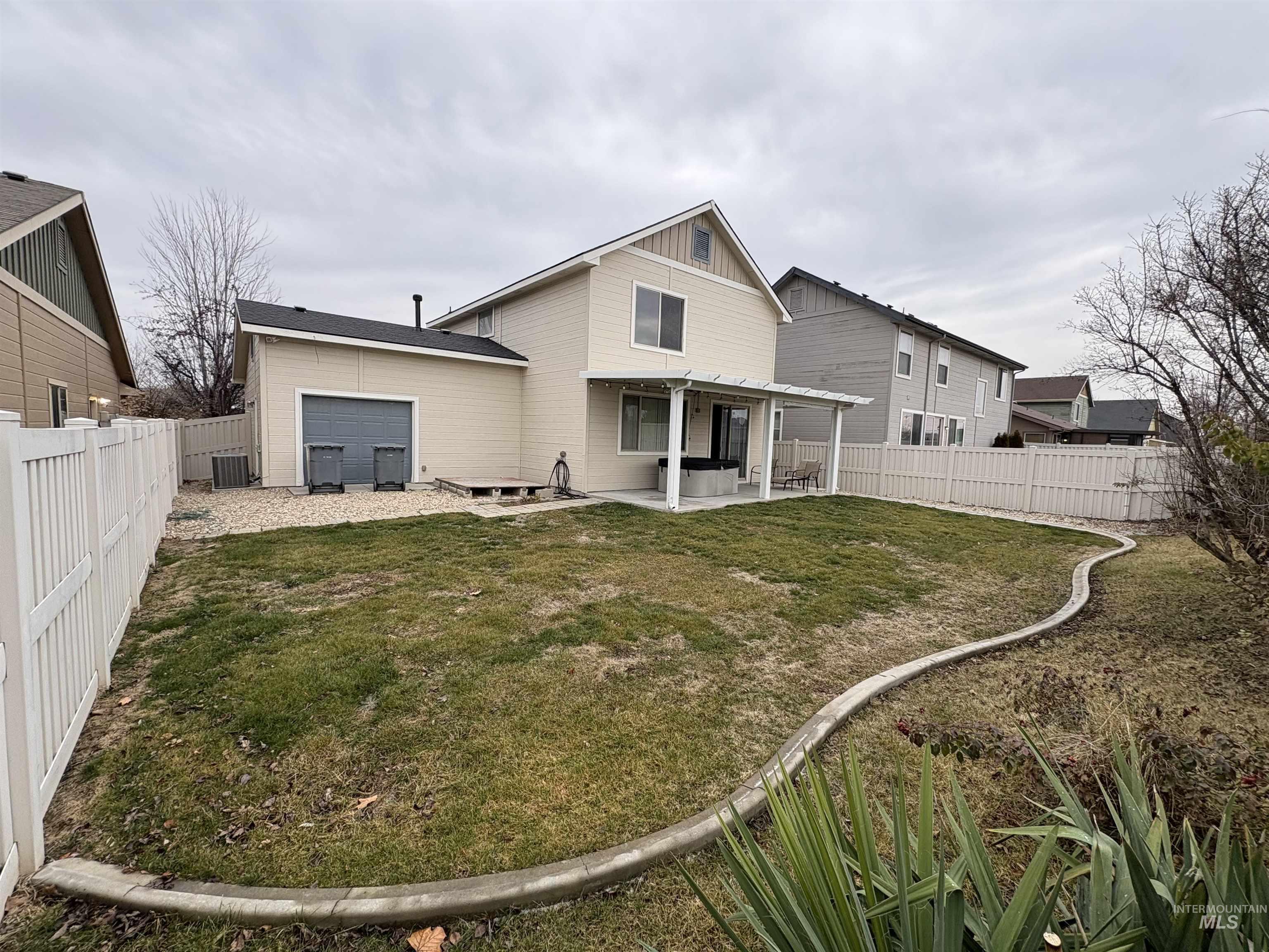 723 Stallion Springs Way Middleton, ID 83644 - Photo 43 of 50 Rear view of property featuring a patio area and a fenced backyard