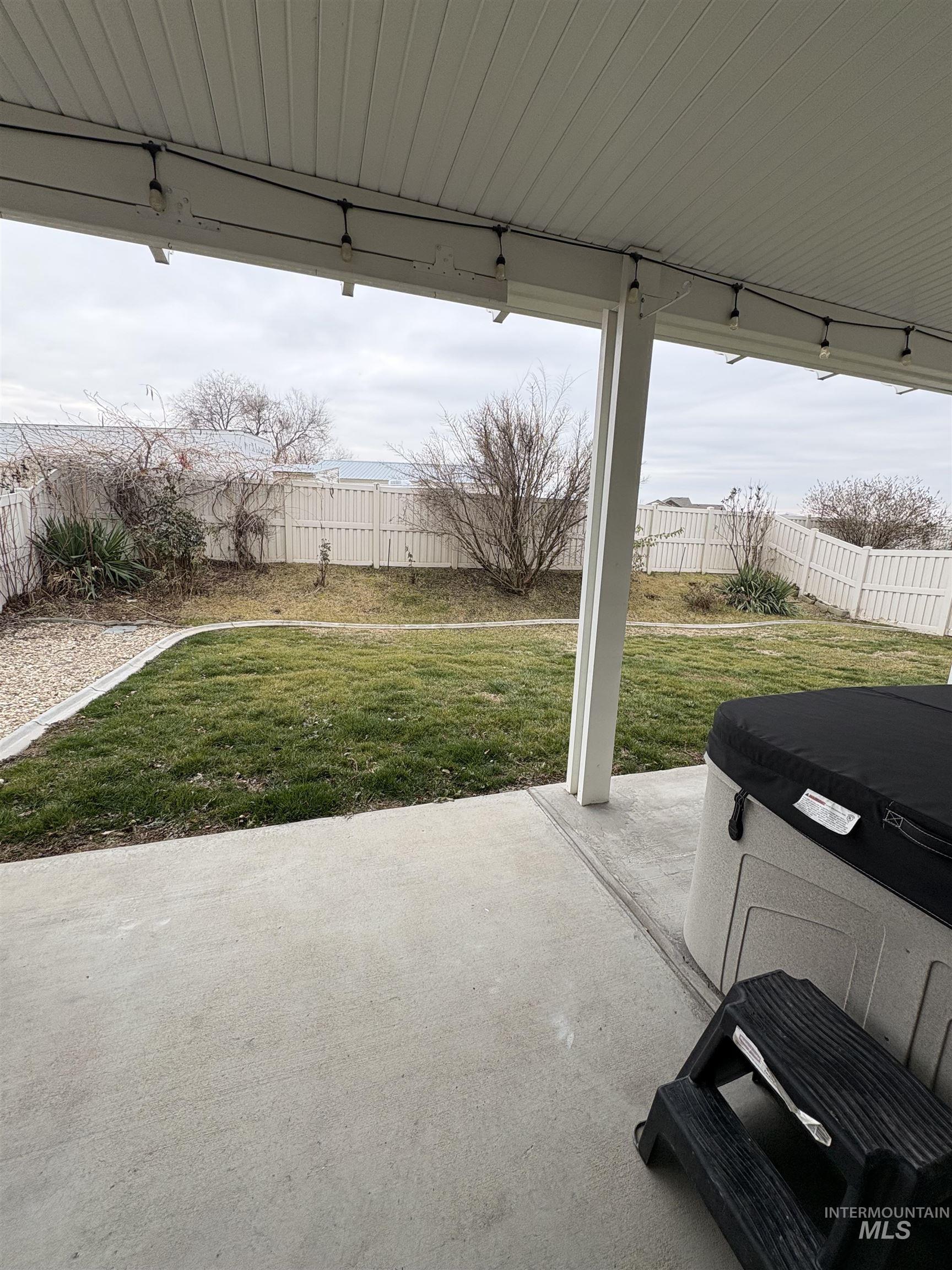 723 Stallion Springs Way Middleton, ID 83644 - Photo 45 of 50 Fenced backyard featuring a patio and a hot tub