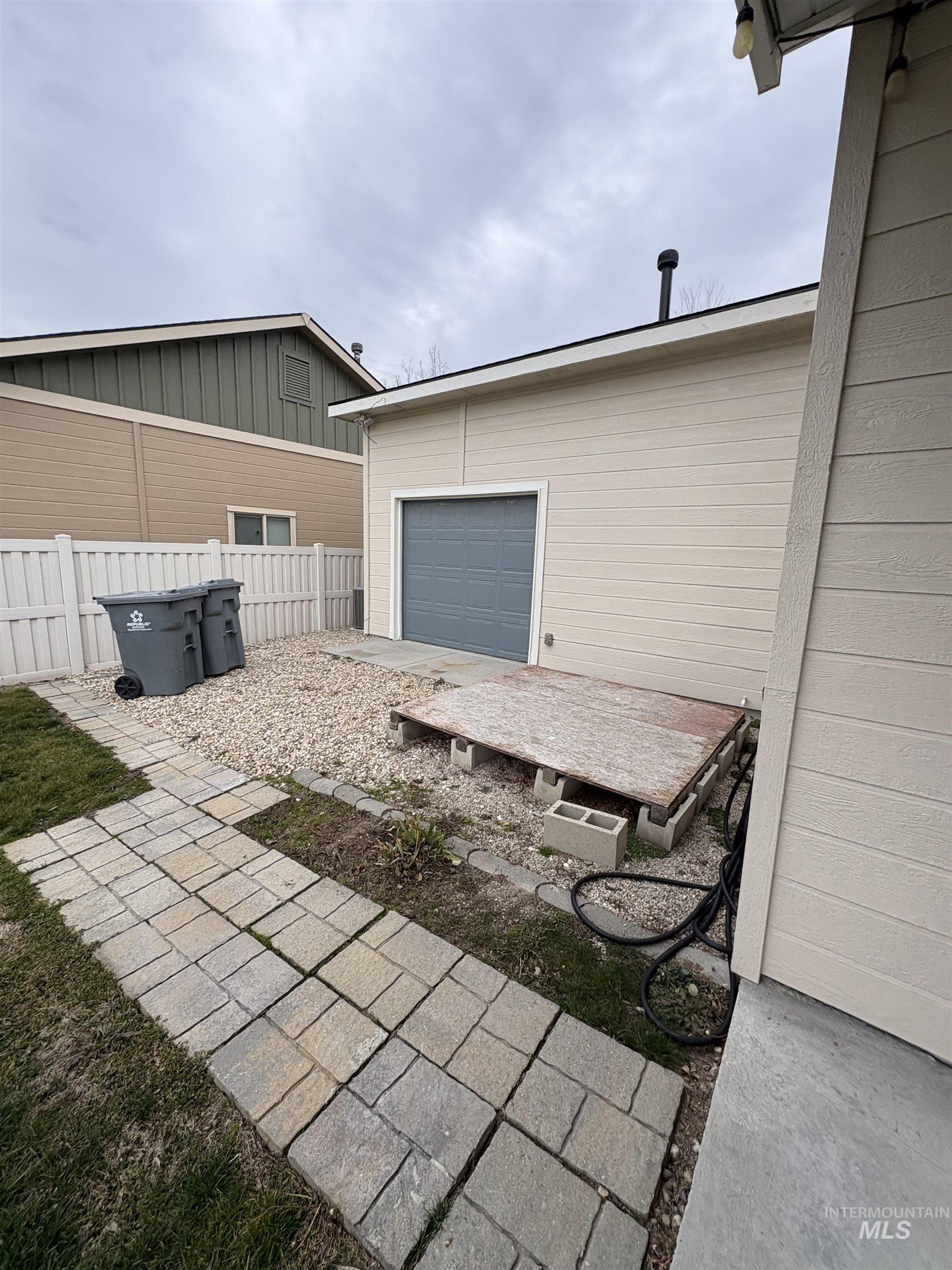 723 Stallion Springs Way Middleton, ID 83644 - Photo 47 of 50 View of patio / terrace featuring a garage