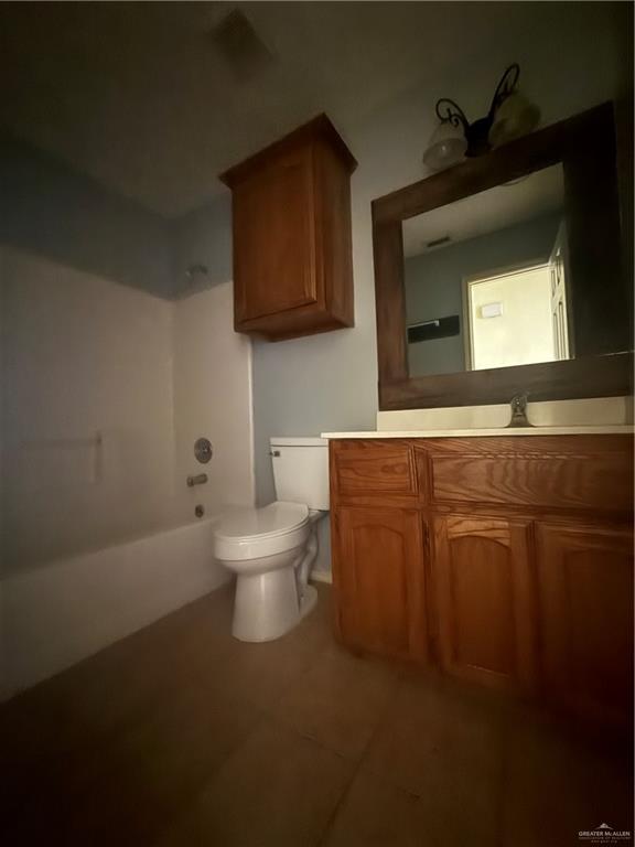 1213 Mineral Rights Lane, Unit 4 Edinburg, TX 78541 - Photo 6 of 10 a bathroom with a toilet a sink and mirror