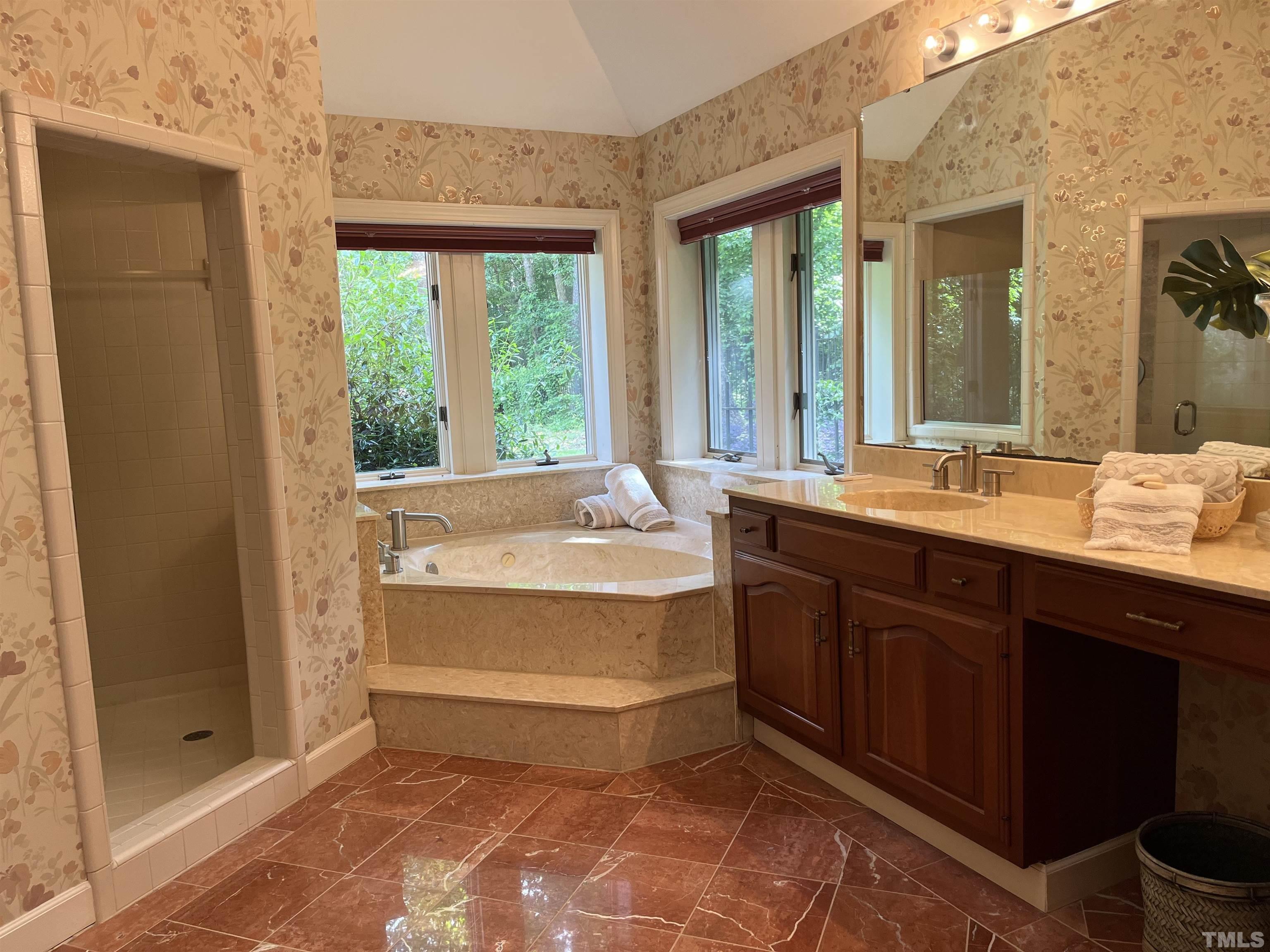 212 Carpathian Way Raleigh, NC 27615 - Photo 8 of 24 a spacious bathroom with a double vanity sink and a large mirror