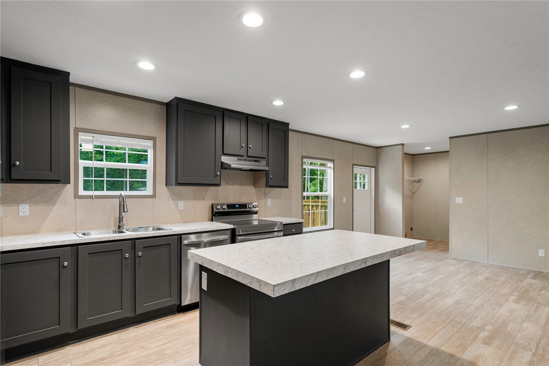 419 Austin Drive Anderson, SC 29624 - Photo 17 of 36 Bright and inviting kitchen with modern appliances and ample counter space for culinary adventures.