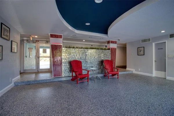 a living room filled with furniture and gym equipment