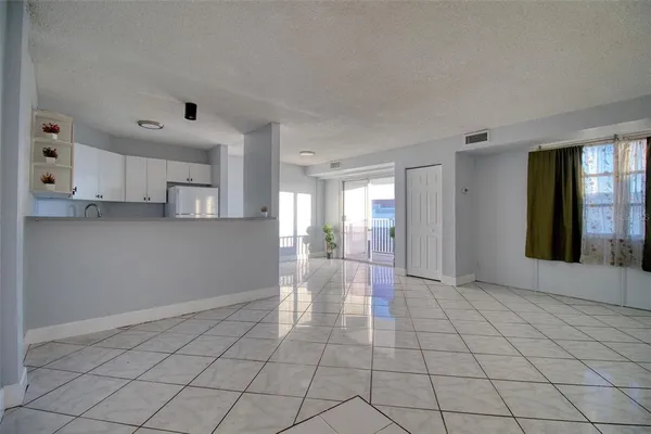 a view of livingroom with kitchen