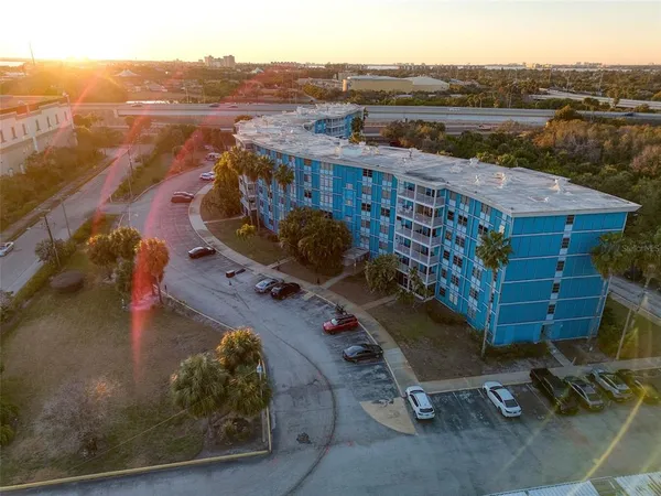 an aerial view of a house with a yard