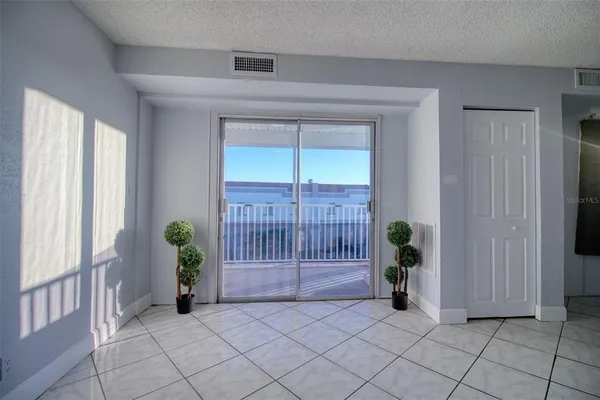a view of an entryway with a flower pot